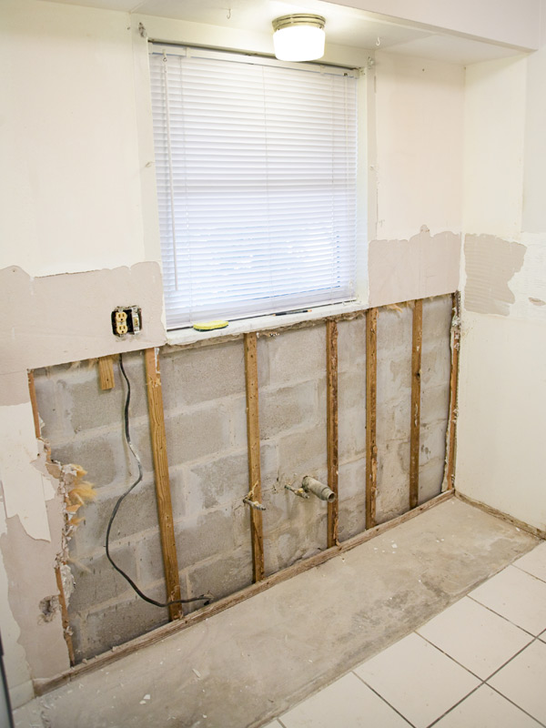 A section of moldy drywall has been removed as part of a mold remediation project